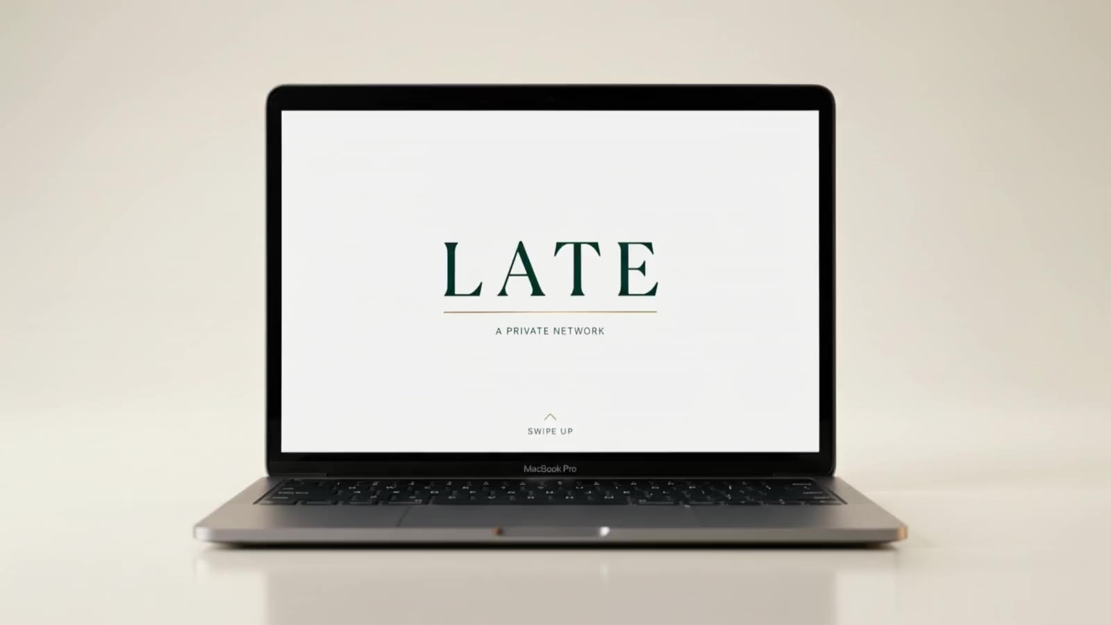 A MacBook opening to the LATE cover screen